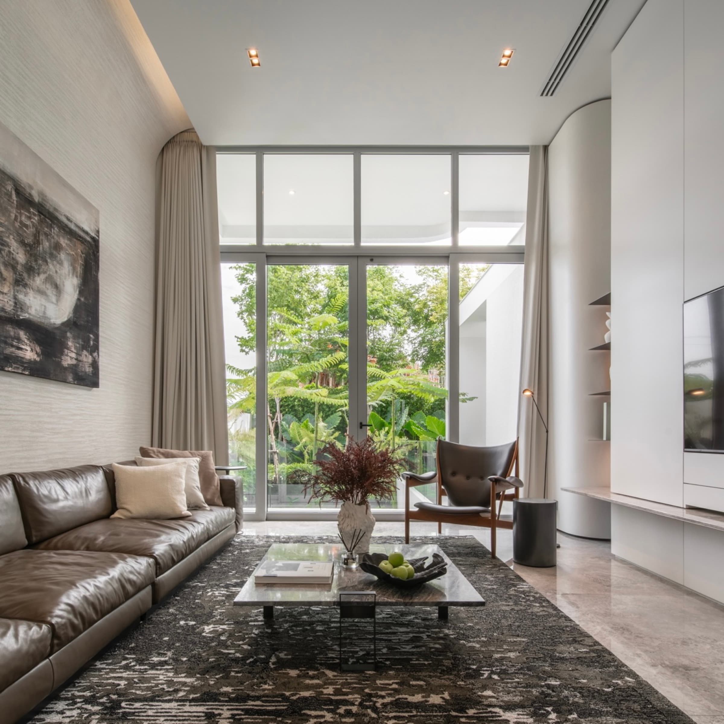 ARQ10 L-House living room opening to trees